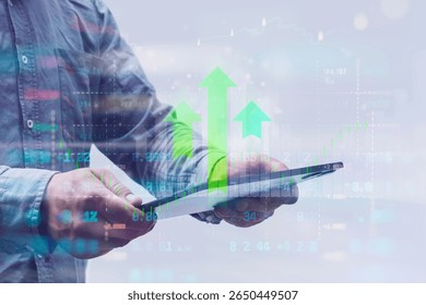 Close-up of a man in a shirt using a tablet with digital stock market data and financial graphs. Concept modern financial technology, online trading and digital analytics - Powered by Shutterstock - Get 15% off with code: PIKWIZARD15