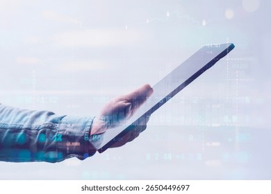 Close-up of a man in a shirt using a tablet with digital stock market data and financial graphs. Concept modern financial technology, online trading and digital analytics - Powered by Shutterstock - Get 15% off with code: PIKWIZARD15