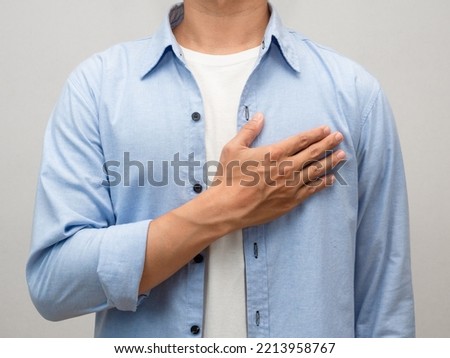 Close-up man touch his chest for lover portrait studio shot