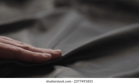 Closeup man touching fine leather - Powered by Shutterstock