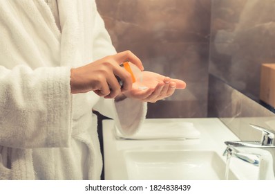 Close-up Of Man Using Aftershave In The Bathroom. 