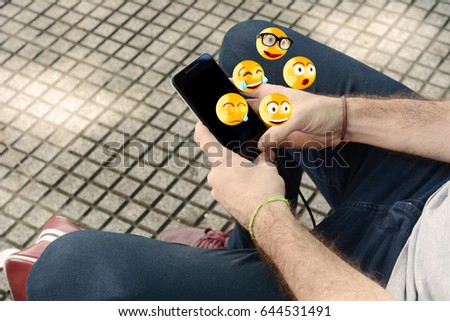 Similar – Nahaufnahme der Frau mit dem Smartphone, die Emojis sendet.