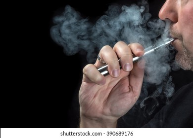 Close-up Of A Man Vaping An Electronic Cigarette