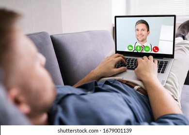 Close-up Of A Man Videoconferencing With Happy Doctor On Laptop