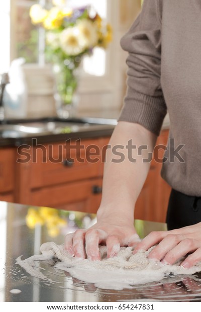 Closeup Man Washing Cleaning Black Granite Royalty Free Stock Image