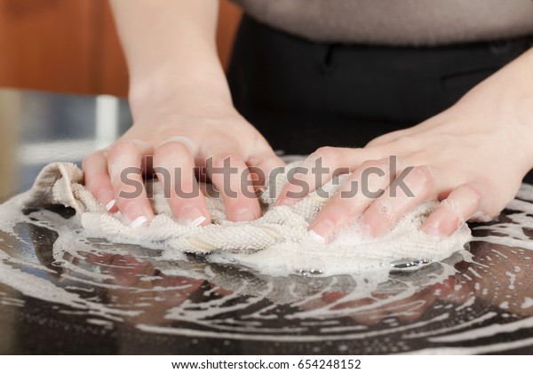 Closeup Man Washing Cleaning Black Granite Royalty Free Stock Image