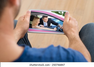 Close-up Of A Man Watching Video On Cellphone