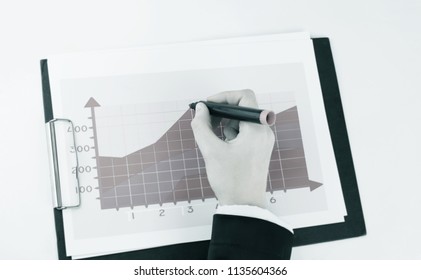 close-up. Manager checking financial schedule. - Powered by Shutterstock - Get 15% off with code: PIKWIZARD15