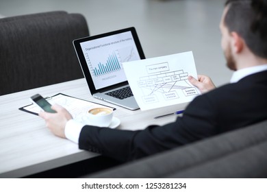 Close-up of manager working with financial documents - Shutterstock ID 1253281234