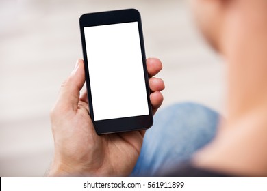 Close-up Of A Man's Hand Holding Cell Phone With Blank Screen