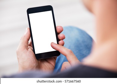 Close-up Of A Man's Hand Holding Cell Phone With Blank Screen