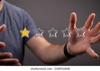 A Closeup Of The Man's Hands Holding Five Stars Ranking System 