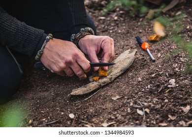 Closeup of man's hands preparing a fire in nature with tinder fungus fomes fomentarius