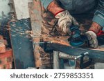 Close-up of manual worker operating grinder with intense sparks, highlighting physical effort and dedication. Concept of hard work, blue collar lifestyle, endurance, and daily labor.