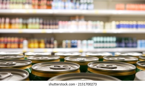 Close-up Of Many Beautiful Cans Of Beer On A Store Shelf