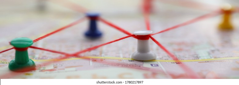 Close-up Of Map Marked With Red Thread Paths Of Movement. Plan Of Street With Buttons Forming Route. Pedestrian Building Route Around City. Navigation Concept