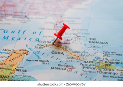Close-up map view of Cuba with a red pushpin on Havana. The Bahamas and parts of the southeastern United States appear in the background.
