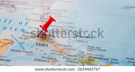 Close-up map view of Cuba with a red pushpin on Havana. The Bahamas and parts of the southeastern United States appear in the background.

