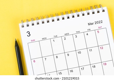 Close-up March 2022 desk calendar on yellow background. - Shutterstock ID 2101219015