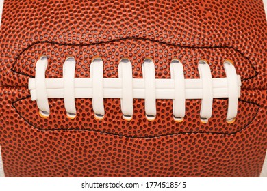 Close-up or marco shoelace of American leather football, full frame, rugby ball. - Powered by Shutterstock