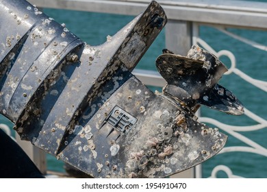 Closeup Of Marine Outboard Engine Covered With Barnacles.