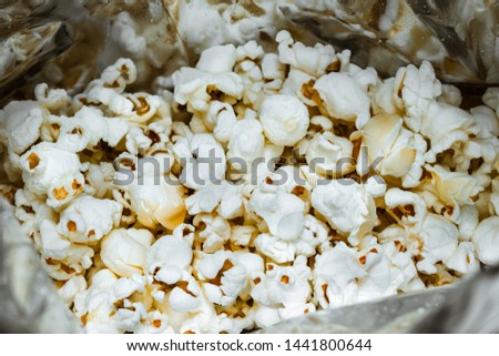 Close-up of a mass of popcorn in an aluminum package