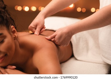 Closeup Of Masseuse Making Back Massage To Unrecognizable Black Woman, Spa Interior