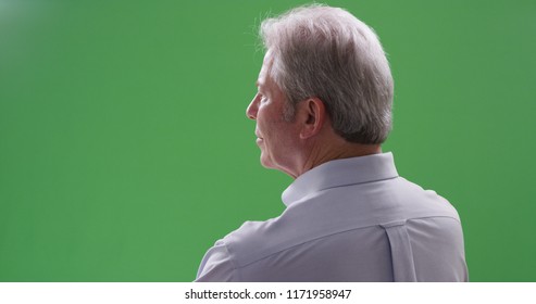 Closeup of mature caucasian man looking away from camera on greenscreen - Powered by Shutterstock