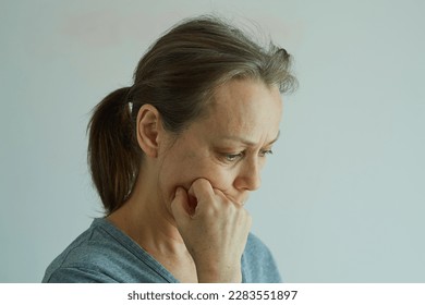 Close-up of a mature pensive woman, feel pain, loneliness, depression. - Powered by Shutterstock