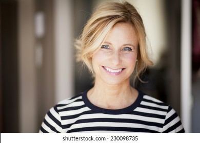 Closeup Of A Mature woman smiling At The Camera