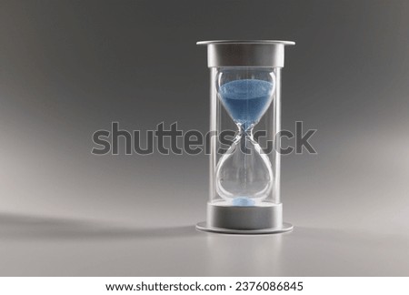 Close-up of measure passing time, countdown, blue sand running through bulbs of hourglass. Urgency, running out of time, transience, hurry up, late concept