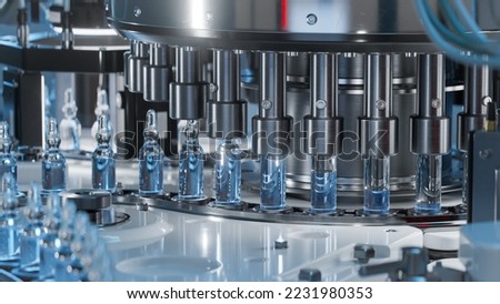 Close-up of Medical Ampoule Production Line at Modern Modern Pharmaceutical Factory. Glass Ampoules are being Filled. Medication Manufacturing Process.