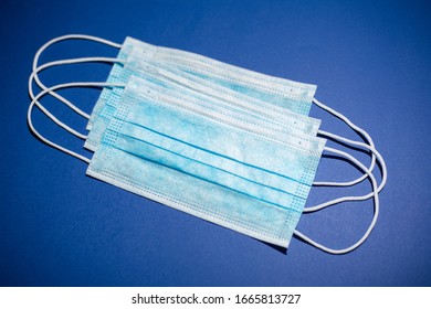 Close-up Of Medical Flu Masks For Protection On Background Of Phantom Blue Color.