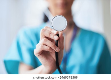 Close-Up of Medical Professional Holding a Stethoscope in Hospital - Powered by Shutterstock