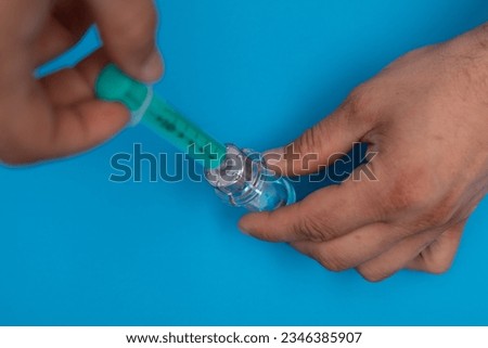 Close-up medical syringe with a vaccine concept
 