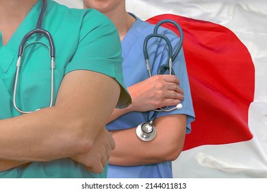 Close-up medical team man and woman surgeons of the Japan flag background. Professional surgery in Japan. Medical technology research institute and doctor staff service concept in Japan