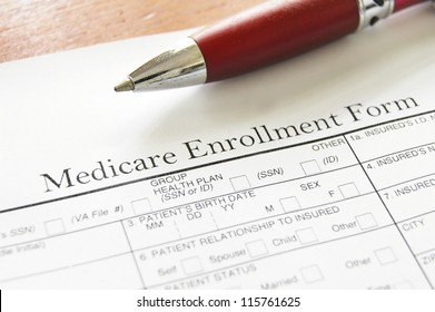 Closeup Of Medicare Enrollment Form And Pen