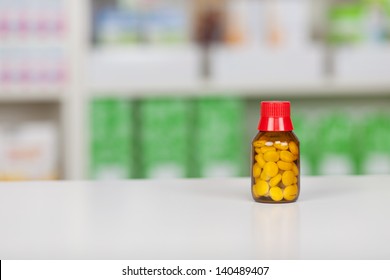 Closeup Of Medicine Bottle On Pharmacy Counter