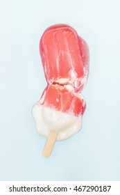 Closeup Of Melted Popsicle On Light Blue Surface