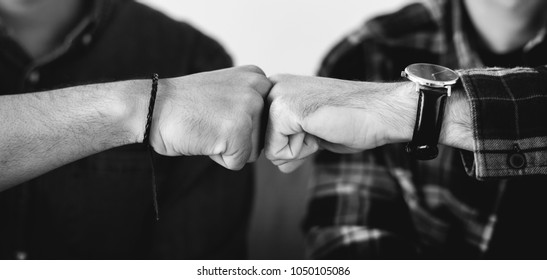 Closeup Of Men Fist Bumping