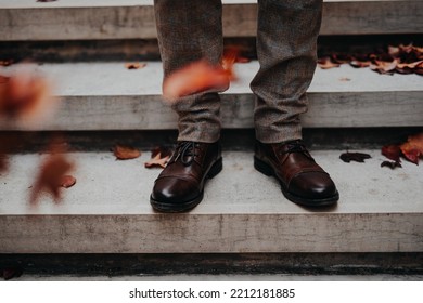 Close-up Of Mens Legs At City Staircase.