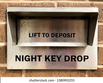 Closeup Of A Metal After-hours Key Drop Box Located On The Side Of An Auto Body Repair Shop.