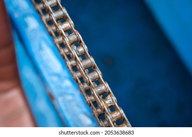 Close-up At Metal Chain Of Electric Engine Motor. Industrial Equipment Photo. Partial Selective Focus At Object Part.