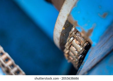 Close-up At Metal Chain Of Electric Engine Motor. Industrial Equipment Photo. Partial Selective Focus At Object Part.