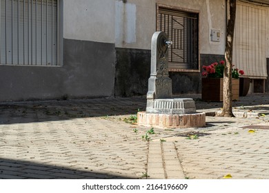 Close-up Of Metal Fountain In A Small Town Park. 