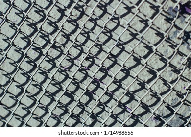 Closeup of metal grid pattern with shadows . Texture .