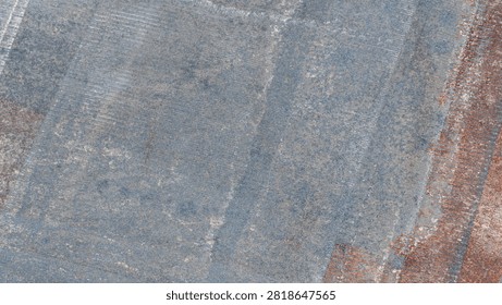 Close-up of metal mesh panel with rust stains. Metal mesh panel shows rust stains on concrete surface. Panel rests on textured concrete ground. Visible rust spots on metal edges