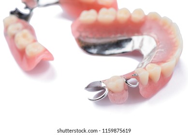 Close-up metal removable partial denture on white background