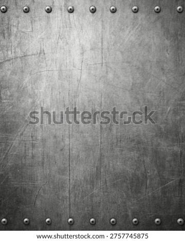 Close-up of a metallic industrial door with riveted surface and bolts