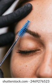 Close-up of microblading procedure on eyebrows
